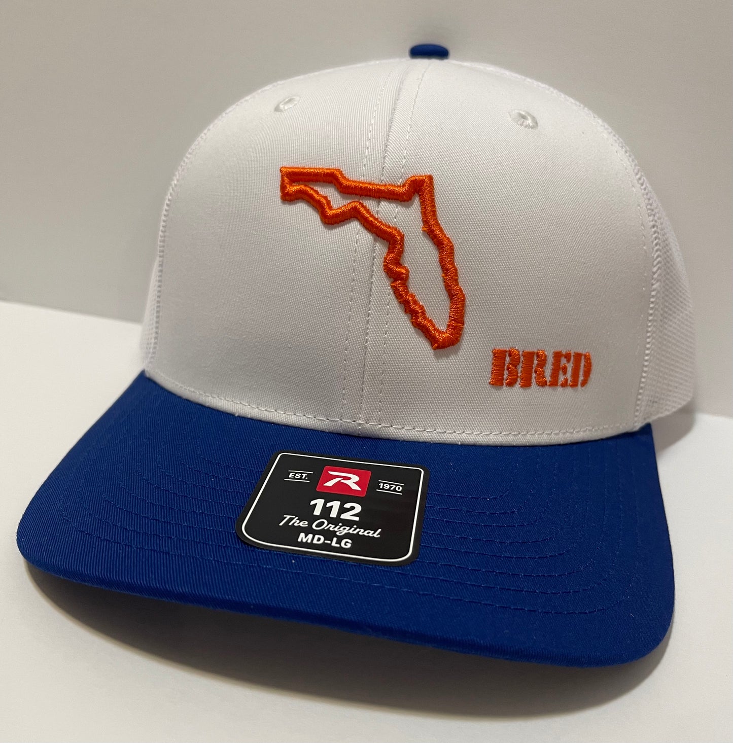 Royal Blue and White with Orange Logo Classic trucker hat
