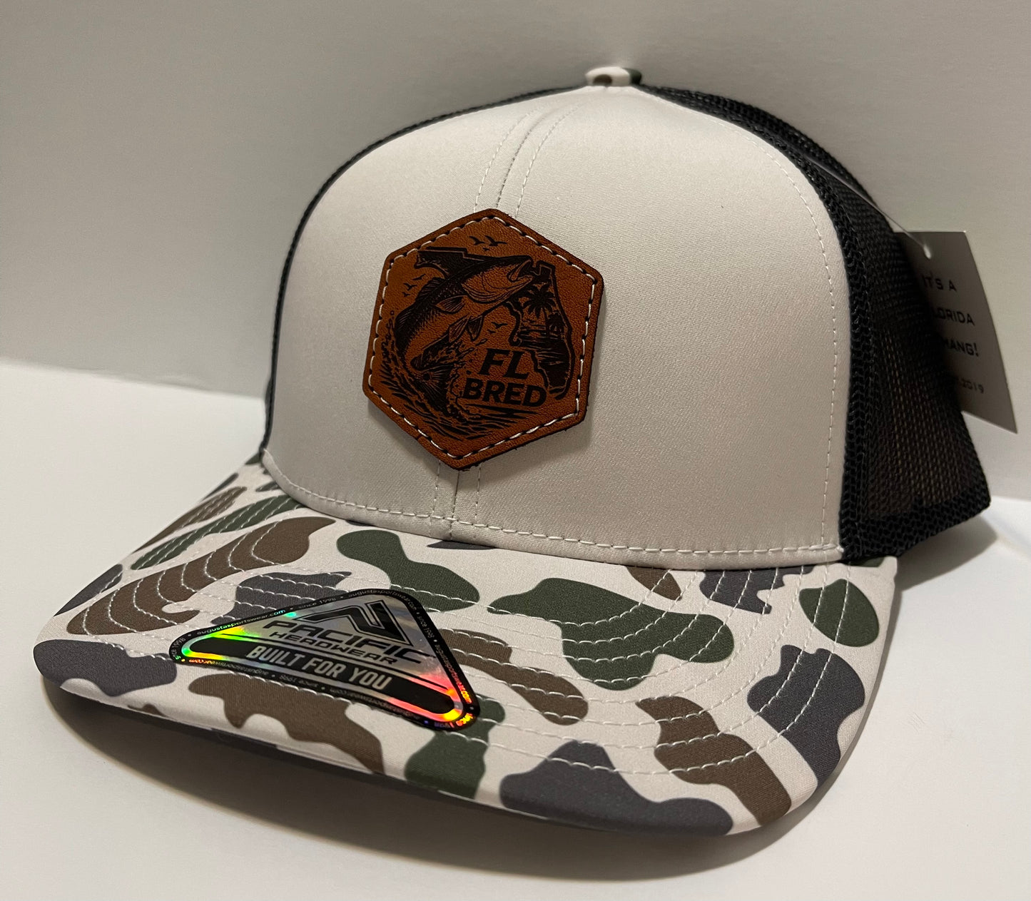 Coastal Camo/Black trucker cap with Red bass & FL leather patch
